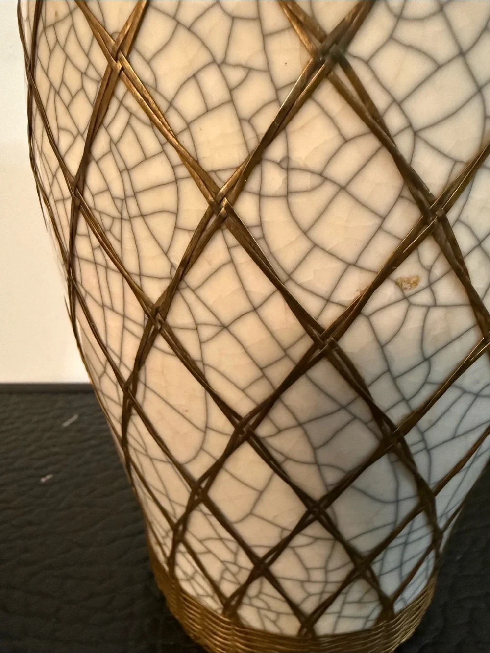 Japanese pottery vase craquelure glaze and a basketweave metal overlay.